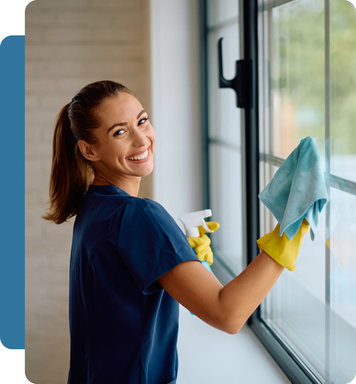 Woman cleaning window with cloth and spray
